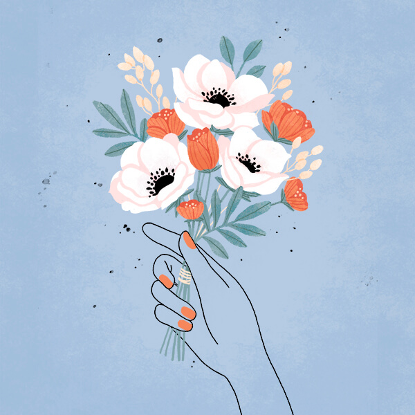Hand holding flowers for sympathy gift